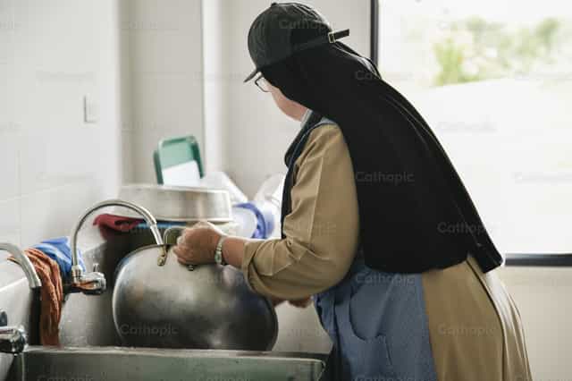 Dagelijks leven van een non - Katholieke stockfoto's