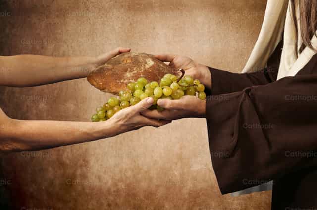 Jesús da pan y uvas - Banco de imágenes católicas - Fotografía por Antonio Gravante