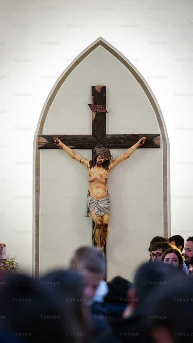 Jesus Christ crucified on wood in church - Catholic stock images