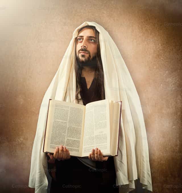 Jesus zeigt die Heilige Bibel - Katholische Stockfotos