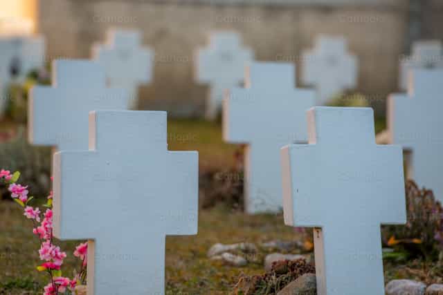 Tombstones at the cemetery - Catholic stock images - Photo by Pierluigi Palazzi