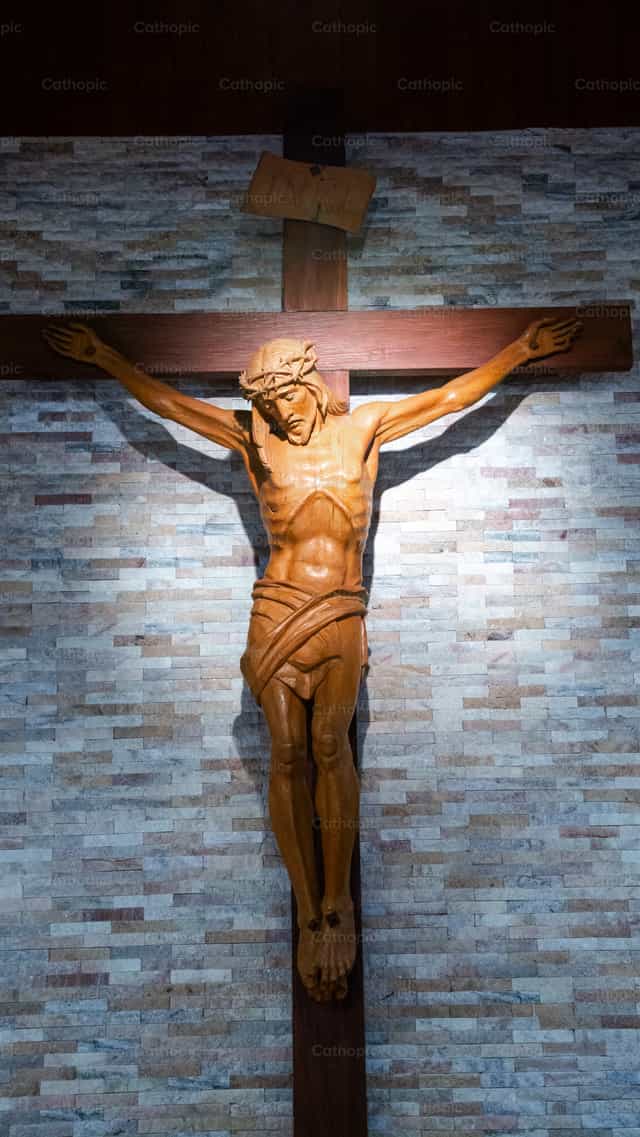 Crucified Christ carved in wood - Catholic stock images