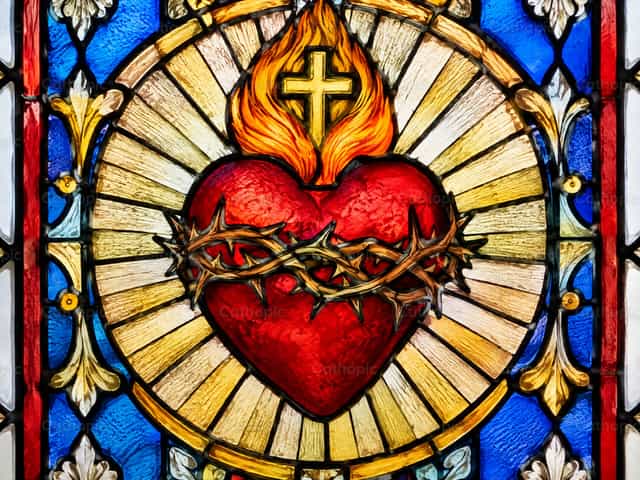 Janela de vitral do Sagrado Coração de Jesus - Imagens católicas de stock