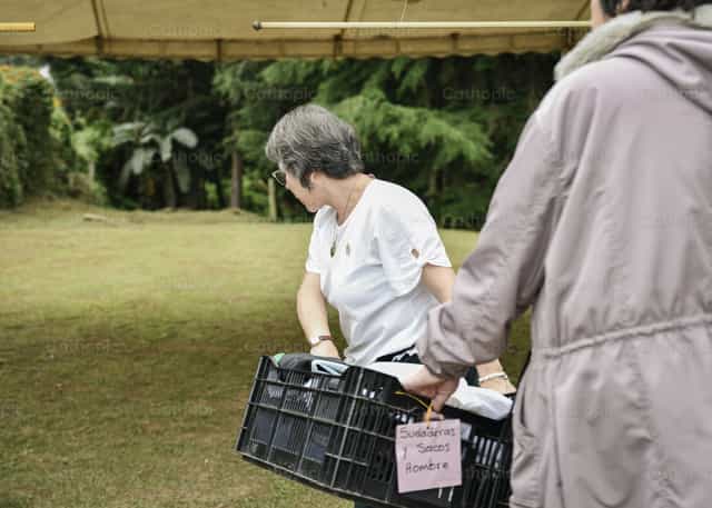 Volunteers at a bazaar - Catholic stock images - Photo by Carolina BR