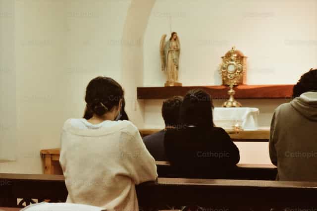 Young Woman Praying in Adoration, Argentina - Catholic stock images