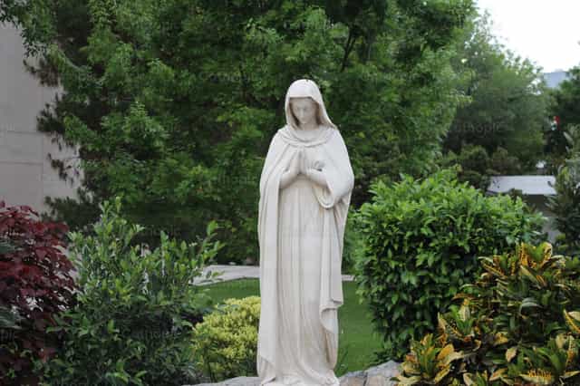 Maria sculpture in the park - Catholic stock images