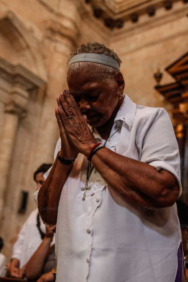 Woman praying - Catholic stock images