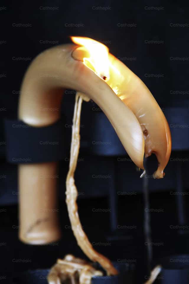 Vela consumida - Imagens católicas de stock
