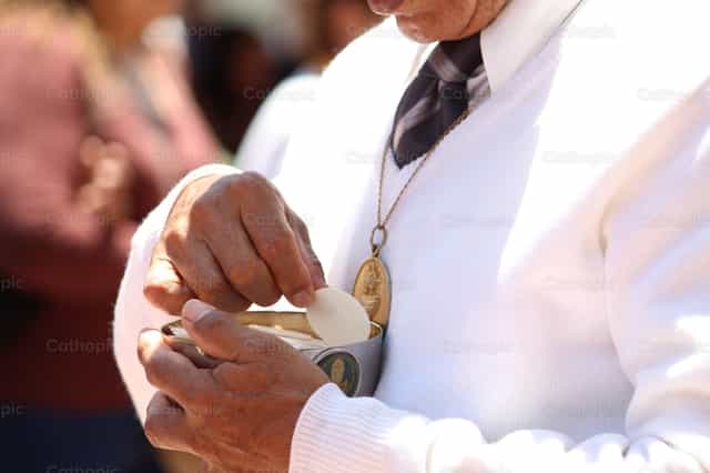 Ministre extraordinaire - Images catholiques de stock