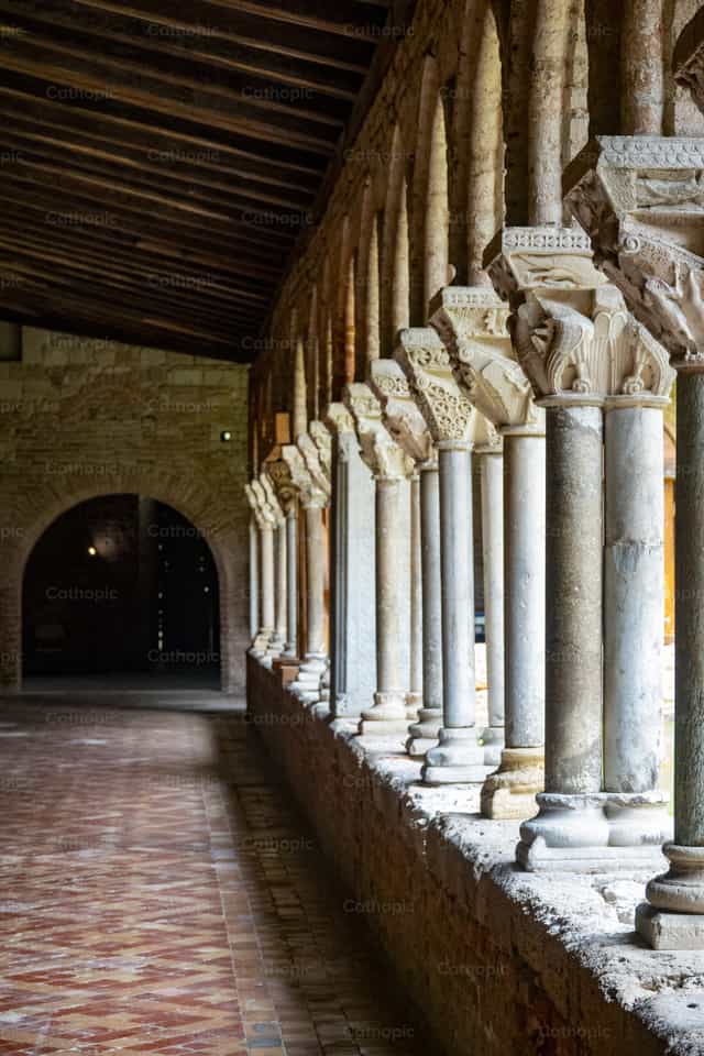 Carved stone columns in historic abbey cloister - Catholic stock images - Photo by Joan Sutter