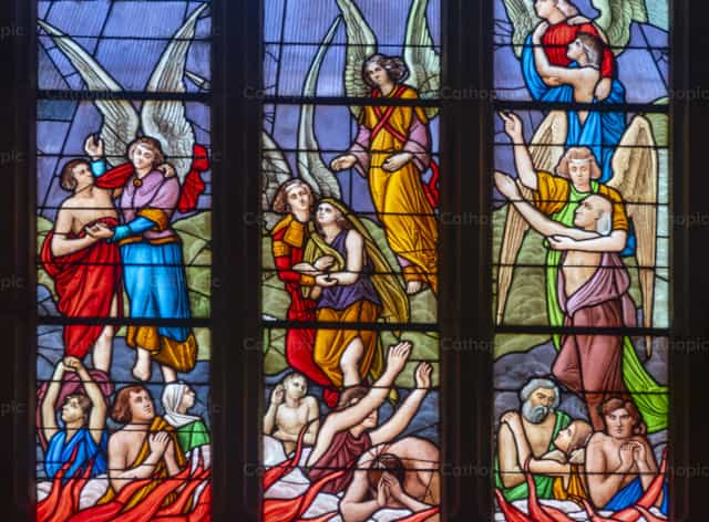 Stained Glass Window Depicting Angels Rescuing Souls - Catholic stock images - Photo by Joan Sutter