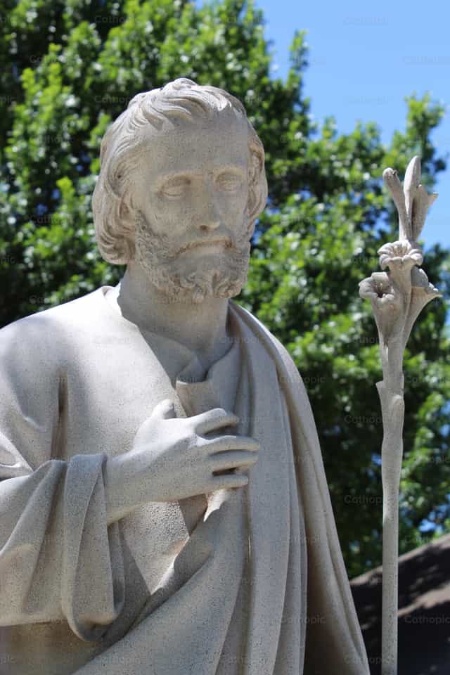 Statue of Saint Joseph with Lily - Catholic stock images