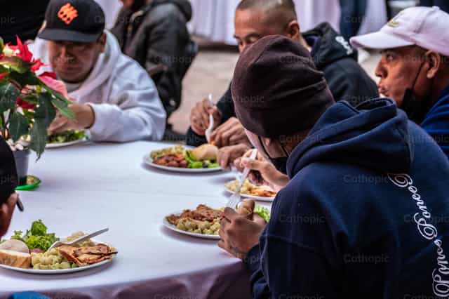 Solidariteitsdiner: Delen met Kerst - Katholieke stockfoto's