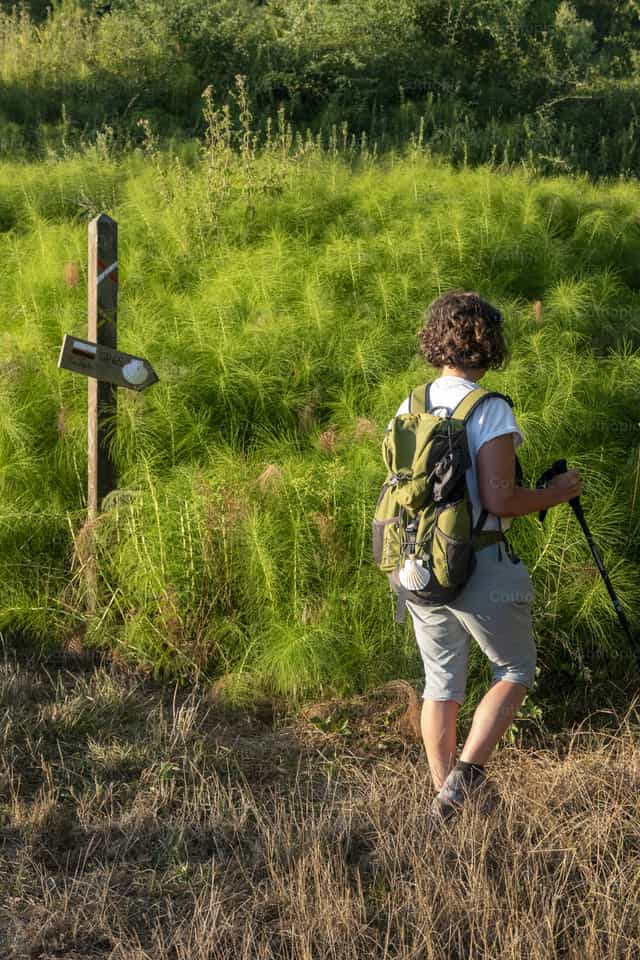 Pilgrim on Camino de Santiago trail - Catholic stock images - Photo by Joan Sutter