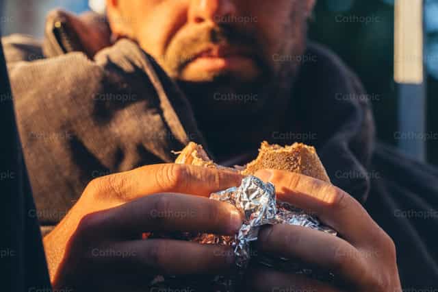 Feeding the hungry - Catholic stock images