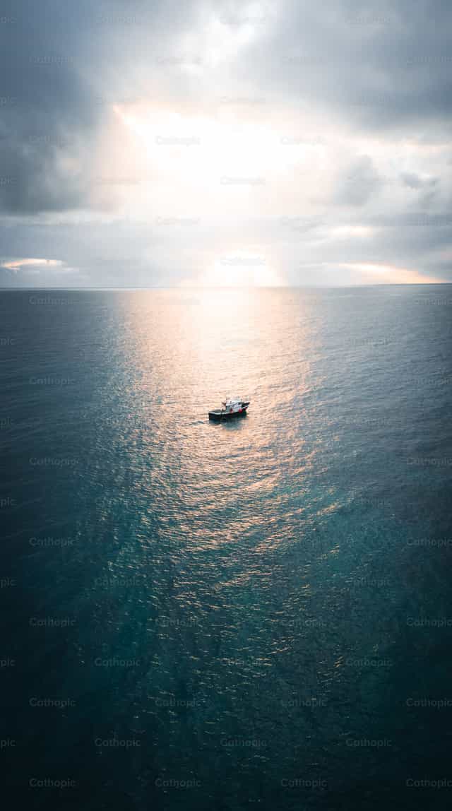 Sunset on Deva Island - Catholic stock images - Photo by Santiago de la Hoz
