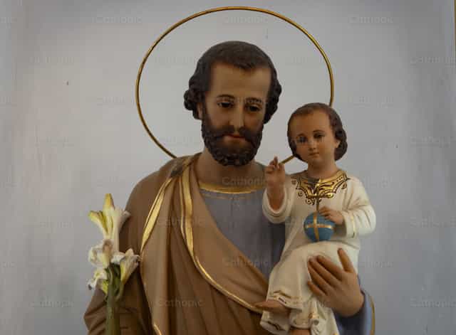Saint Joseph holding baby Jesus - Catholic stock images - Photo by Joan Sutter
