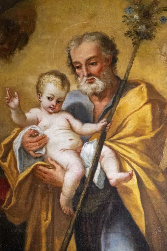 San José sosteniendo al Niño Jesús - Banco de imágenes católicas - Fotografía por Joan Sutter