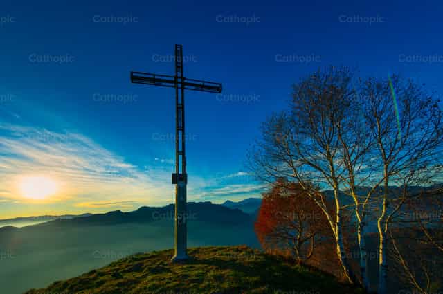 Summit of a mountain with cross - Catholic stock images - Photo by Michelangelo Oprandi