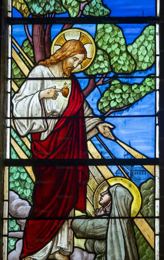 Stained glass window depicting Sacred Heart - Catholic stock images - Photo by Joan Sutter