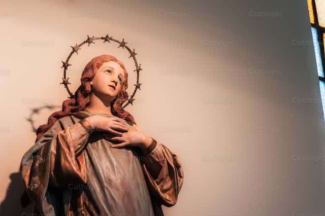Statue of Mary in a Church with Rays of Light - Catholic Stock Images