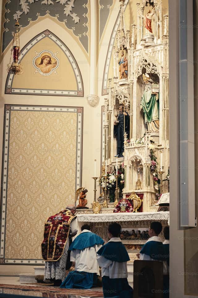 Priest walks up to the altar - Catholic Stock Images