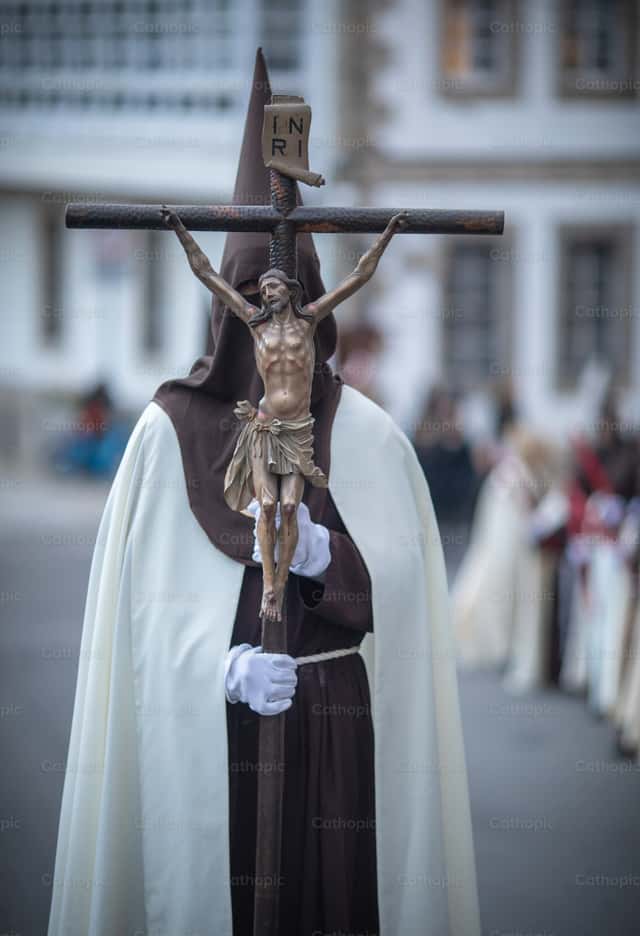 Man with crucifix and bonnet - Catholic Stock Images