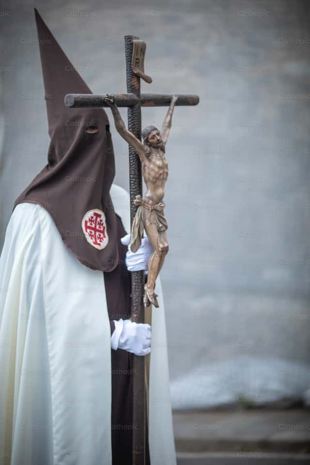 Man with crucifix and bonnet - Catholic Stock Images