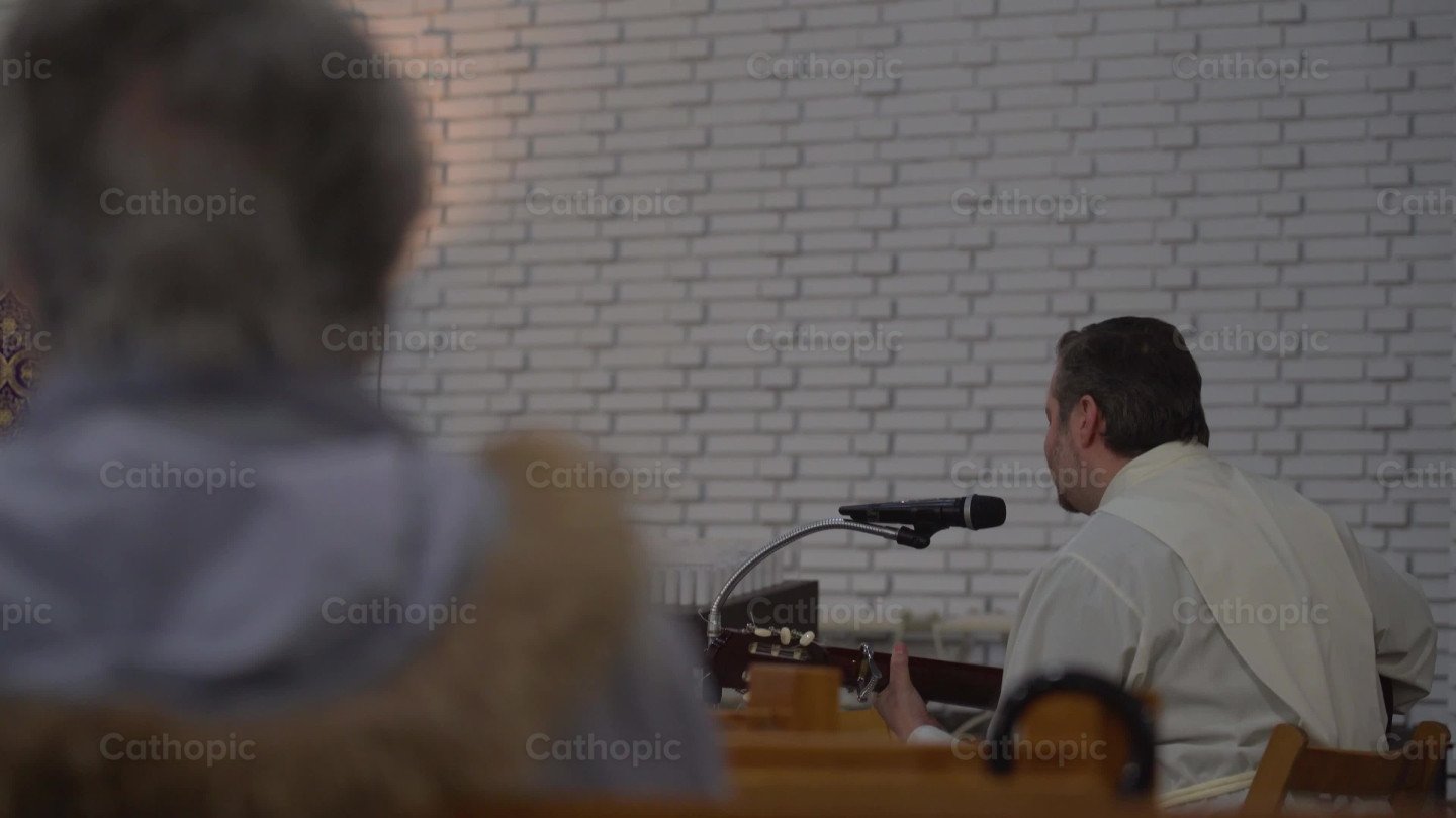 Priest Playing Guitar, Shot 5 video | Cathopic